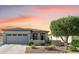 Charming single-story home with a well-maintained front yard and inviting entrance; attached garage and desert landscaping at 17520 W Fairview St, Goodyear, AZ 85338