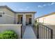 Inviting front porch featuring a cozy seating area, perfect for relaxing and enjoying the outdoors at 17520 W Fairview St, Goodyear, AZ 85338