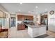 Spacious kitchen with a central island, stainless steel appliances, and ample cabinet space for storage at 17520 W Fairview St, Goodyear, AZ 85338