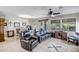 Cozy living room featuring comfortable seating, a ceiling fan, and an inviting atmosphere for relaxation and entertainment at 17520 W Fairview St, Goodyear, AZ 85338