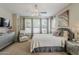 Bedroom featuring natural light from large windows, stylish decor, and a soothing color palette at 1776 E Laddoos Ave, Queen Creek, AZ 85140