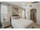 Bright bedroom with neutral tones, and large windows, furnished with elegant decor at 1776 E Laddoos Ave, Queen Creek, AZ 85140