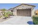 Attractive home featuring a well-maintained lawn, desert landscaping, and a spacious driveway at 1776 E Laddoos Ave, Queen Creek, AZ 85140