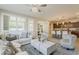 Open-concept living room with easy access to the kitchen, offering a seamless entertaining space at 1776 E Laddoos Ave, Queen Creek, AZ 85140