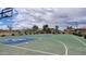 A community recreation area includes a basketball court and benches amid trees and shrubs at 18224 W La Senda Dr, Surprise, AZ 85387
