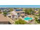 Aerial view of the home featuring a backyard pool, solar panels, covered patio, and fenced yard at 18419 W Maui Ln, Surprise, AZ 85388