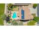 Aerial view of home with a sparkling pool, solar panels, and manicured landscaping at 18419 W Maui Ln, Surprise, AZ 85388