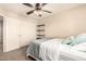 Comfortable bedroom featuring a full-size bed with shelving and window providing natural light at 18419 W Maui Ln, Surprise, AZ 85388