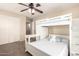 Well-lit bedroom with built-in bunk bed, desk, and closet, perfect for a room at 18419 W Maui Ln, Surprise, AZ 85388