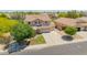Beautifully landscaped home featuring a three-car garage, and a large driveway at 18419 W Maui Ln, Surprise, AZ 85388