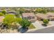 Inviting home with a three-car garage, lush lawn, and beautiful landscaping at 18419 W Maui Ln, Surprise, AZ 85388