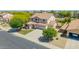 Beautiful two-story home featuring a three-car garage and a well-manicured front yard at 18419 W Maui Ln, Surprise, AZ 85388