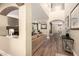 Grand foyer with high ceilings, arched doorways, and hardwood floors leading into a spacious living area at 18419 W Maui Ln, Surprise, AZ 85388