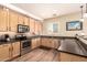 Fully equipped kitchen with modern appliances and plenty of counter space at 18419 W Maui Ln, Surprise, AZ 85388
