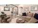 Inviting living room featuring wood floors, comfortable seating, and stylish decor at 18419 W Maui Ln, Surprise, AZ 85388