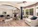 Spacious living area with fireplace, comfortable sofas, and an open layout at 18419 W Maui Ln, Surprise, AZ 85388