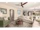 Open concept living area with comfortable seating, stylish decor, and natural light at 18419 W Maui Ln, Surprise, AZ 85388