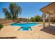 Outdoor pool and patio area, perfect for summer relaxation and entertaining guests at 18419 W Maui Ln, Surprise, AZ 85388