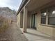View of covered patio area in the backyard with hill in background at 18447 W Verdin Rd, Goodyear, AZ 85338