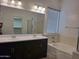 Bathroom showcasing a double sink vanity, bath tub, and updated fixtures at 18447 W Verdin Rd, Goodyear, AZ 85338