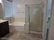 Bright bathroom featuring a soaking tub, shower, and tile flooring at 18447 W Verdin Rd, Goodyear, AZ 85338