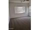 Carpeted bedroom featuring a ceiling fan and natural light at 18447 W Verdin Rd, Goodyear, AZ 85338