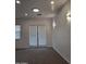 Bright living room with modern lighting and double doors that let in plenty of light at 18447 W Verdin Rd, Goodyear, AZ 85338