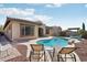 Inviting backyard oasis with a sparkling pool, relaxing lounge chairs, and outdoor seating areas at 18530 E Mockingbird Ct, Queen Creek, AZ 85142