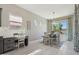 Bright dining area featuring stylish light fixture, neutral paint and views to the exterior at 18530 E Mockingbird Ct, Queen Creek, AZ 85142