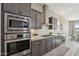 Gourmet kitchen featuring stainless steel appliances and granite countertops at 18530 E Mockingbird Ct, Queen Creek, AZ 85142