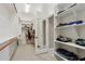 Organized walk-in closet with built-in shelves and hanging rods for optimal storage at 18530 E Mockingbird Ct, Queen Creek, AZ 85142