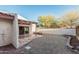 Backyard with decorative rock and stone landscaping, covered patio, and perimeter fencing at 1918 S Shannon Dr, Tempe, AZ 85281