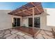 Backyard patio with pergola, sliding doors to home, and mix of stone and tile flooring at 1918 S Shannon Dr, Tempe, AZ 85281