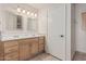 Bathroom featuring a double sink vanity with mosaic-framed mirrors and tile flooring at 1918 S Shannon Dr, Tempe, AZ 85281