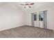 Cozy bedroom featuring plush carpeting, neutral walls, and great natural light from two windows at 1918 S Shannon Dr, Tempe, AZ 85281