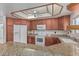 A beautifully appointed kitchen with granite countertops, white appliances, and ample cabinet space at 1918 S Shannon Dr, Tempe, AZ 85281