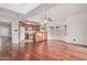 Open floor plan with wood floors and kitchen featuring white appliances and light wood cabinets at 1918 S Shannon Dr, Tempe, AZ 85281