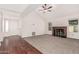 Bright living room featuring vaulted ceilings, carpet and hardwood flooring with door to the front at 1918 S Shannon Dr, Tempe, AZ 85281