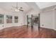 Spacious living area with hardwood flooring, vaulted ceilings, and large windows at 1918 S Shannon Dr, Tempe, AZ 85281