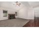 Bright living room featuring vaulted ceilings, cozy fireplace and a mix of carpet and wood flooring at 1918 S Shannon Dr, Tempe, AZ 85281