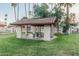 Community picnic area featuring a covered picnic table and grassy lawn at 1918 S Shannon Dr, Tempe, AZ 85281