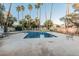 Community pool with palm trees and lounge chairs offering a refreshing outdoor amenity at 1918 S Shannon Dr, Tempe, AZ 85281
