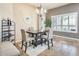 A beautifully designed dining room with a stylish chandelier and travertine floors at 20608 N 57Th Ave, Glendale, AZ 85308