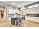 Modern kitchen with a center island, granite countertops, and stainless steel appliances at 20608 N 57Th Ave, Glendale, AZ 85308