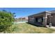 This backyard features a covered patio, pool, and string lights, perfect for outdoor entertaining and relaxation at 20838 E Vía De Arboles --, Queen Creek, AZ 85142