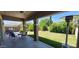 Inviting covered patio overlooking a lush backyard, perfect for outdoor dining and relaxation at 20838 E Vía De Arboles --, Queen Creek, AZ 85142