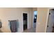 Bathroom with an open closet and access to other rooms in the house at 20838 E Vía De Arboles --, Queen Creek, AZ 85142