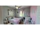Charming bedroom with whimsical decor, soft pastel accents, and ample natural light for a delightful space at 20838 E Vía De Arboles --, Queen Creek, AZ 85142