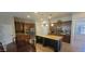 Spacious open-concept kitchen featuring an island with counter seating, stainless appliances, and ample cabinet space at 20838 E Vía De Arboles --, Queen Creek, AZ 85142