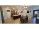 Well-lit kitchen with island and barstool seating and dark wood cabinets and countertops at 20838 E Vía De Arboles --, Queen Creek, AZ 85142